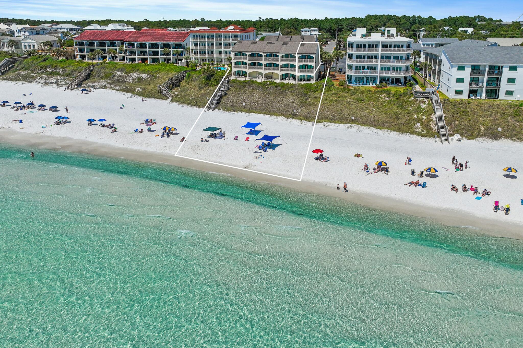 Prominently positioned to showcase the stunning views of turquoise-hued waters on 30A throughout the unit, this like-new and never rented, coastal retreat spans three distinct levels totaling over 1,800 square feet. Upon initial entry, you're welcomed by a hallway that opens into a spacious main living and dining area, featuring stunning Gulf views, a thoughtfully designed coastal color palette, and soaring ceilings accented by elegant wood-plank tile flooring. Step outside to the adjoining arched terrace, the perfect place for admiring the beautiful palate of mesmerizing hues with unobstructed 180-degree views. The fully renovated kitchen features a luxury appliance suite, stunning quartz countertops coupled with a stunning backsplash and new fixtures. Ascending to the second floor, the spacious, gulf-facing primary suite is flooded with natural light. The spa-like ensuite features dual vanities, a walk-in wet room and custom cabinetry providing additional storage options. Just down the hall, the guest suite offers 2 queen size beds, a private bath and terrace overlooking the community's pool. The top floor loft quarters boast two twin size beds and is perfect place for the teenagers and kids to hang out.

This, fully furnished end-unit has been immaculately maintained and features tons of premium upgrades to include all new high impact windows and sliders, furnishings, fixtures, a new washing machine and dryer, new AC (2021) with integrated UV air filtration, professionally cleaned ductwork, a new water heater (2018), and is equipped with automatic hurricane shutters that were recently serviced, and much more.

The low-density community of Seagrove Dune Villas is tucked away in the heart of Seagrove Beach sprawling on nearly two acres and located further away from the public beach accesses, providing a more intimate and private setting..The complex is well maintained and just completed some recent updates which include adding dedicated golf-cart parking, landscaping rejuvenation, newly painted exterior, a newly resurfaced pool to include new pool loungers, a newly rebuilt boardwalk and paver path to the beach, and much more!
The culmination of luxury and exclusiveness creates a truly intimate setting while remaining geographically poised near all of the acclaimed dining and entertainment venues 30A has to offer and is just one mile east of Seaside! Impressive rental potential with projections over $115,000 per year and basically all-inclusive dues makes this a compelling opportunity for both investors and second-home residents alike. Inquire today and start living the coastal lifestyle.
