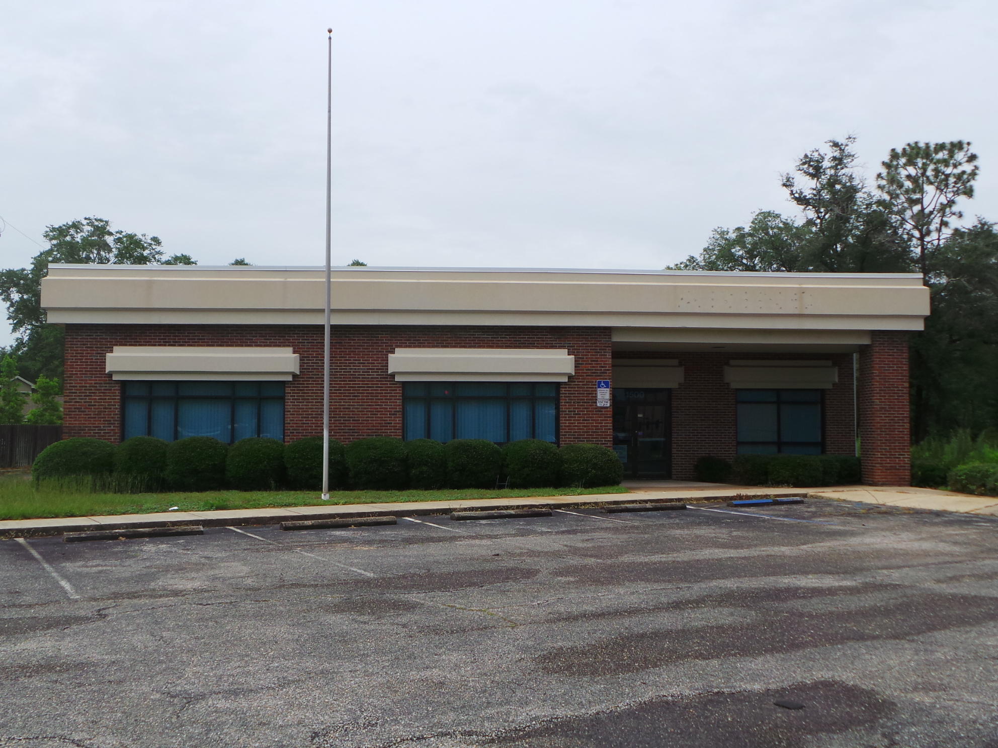 Professional stand alone office bldg. located at the traffic-controlled, busy intersection of Lewis Turner Blvd and Hospital Rd. Many private offices, spacious conference room, break room, covered rear entrance, plenty of parking. Building being sold ''As Is.'' Adjacent apprx 3 acres vacant land also available.