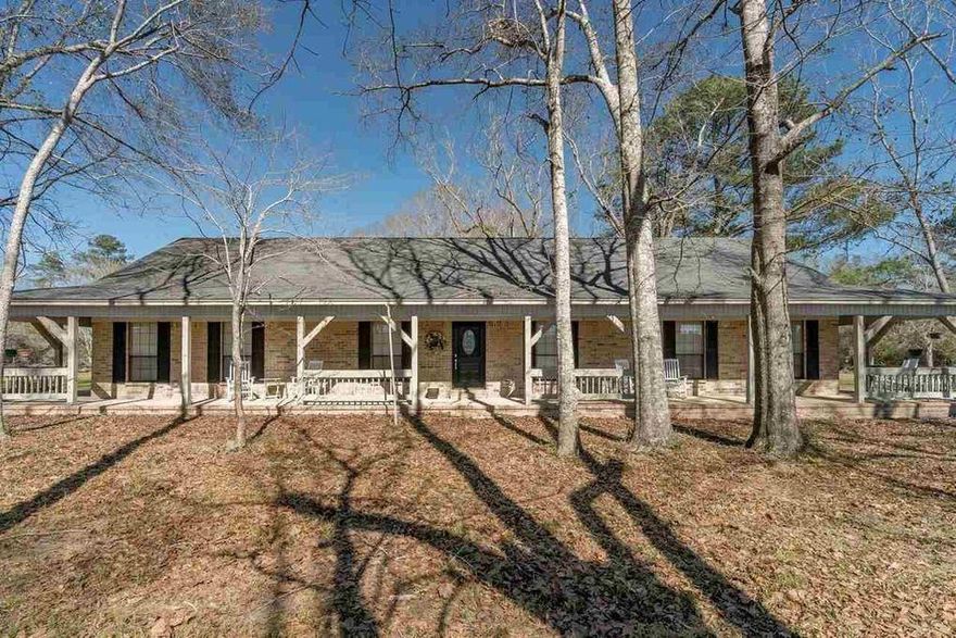 Virtual Tour https://youtu.be/Vre1f1rdcNg New AC and tankless water heater, just installed. Welcome to Beth Eden Ranch!
Enjoy privacy and the great outdoors on this secluded property that's only 10 miles from I-10. Come take a look at the grazing
pasture land, wonderful riding trails and a spring fed creek. The property features a large ranch style home with a wraparound
porch, which is the perfect place to sit back and watch nature. The workshop is 40 x 50 with a 40 x 20 stable. The property has
rich farm land and is 60 ft above sea level and boast pecan trees, live oak, cedar chestnuts, long leaf pines, oaks, mature timber, and wild flowers.  Horseback trails throughout the property.  There is an
additional 134 acres available with this property MLS 551567 .