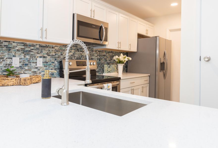 Welcome home to this quaint townhouse boasting spacious rooms, ample storage, and trendy finishes. You'll love the shiplap entryway to hang your hat and keys as you come in to a gorgeous kitchen, open living area and room for bar stools to entertain your guests. Upstairs you'll appreciate the large master bedroom with a generous sized walk in closet.   All new everything!Upgrades include new siding, windows, fence, stainless steel appliances, quartz countertops, lvp floors, carpet,light fixtures, kitchen cabinets, vanities and paint. All the big ticket items have been replaced-2022 HVAC, HWH, and roof. This property is a great primary residence or short/long term rental.Close to Eglin and Hurlburt, Fort Walton Beach High School, .5 miles to the sound and 10 min to the beach. No HOA!