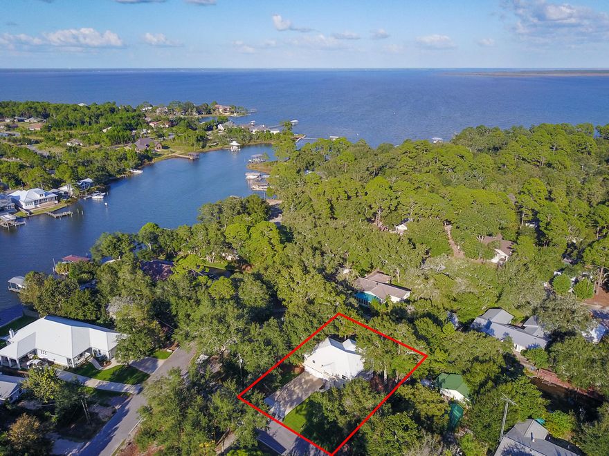 Enjoy waterfront living without the exorbitant price tag. Imagine walking out from your newly landscaped yard and launching your kayak or paddle board from your private boardwalk into the canal with direct access to Buck Bayou and the Choctawhatchee Bay. For the less adventurous, side tie your flats boat and enjoy easy access to the amazing ecosystem of Hogtown Bayou with it's year round fishery, gorgeous sunrises, and playful porpoises. A massive remodel graciously greets you as walk through the door of this 4 bedroom 3 bath home. The upper level is comprised of a spacious open floor plan for entertaining, generous master suite, and an additional bed/bath. The updated kitchen, with it's soft coastal colors, contains an awesome pantry that doubles as an additional laundry if needed. On