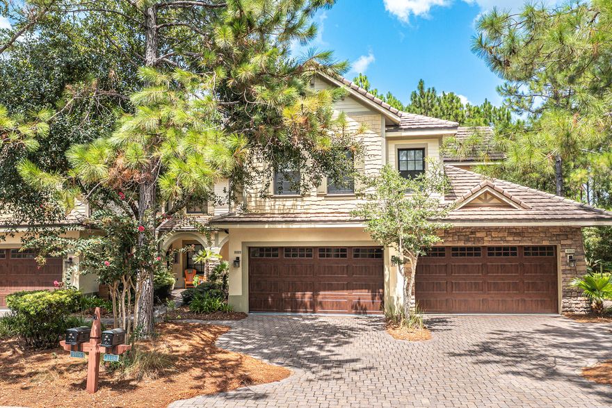 Clubside Unit 202 is walking distance to the Sharks Tooth Clubhouse with multiple dining venues, and the practice 'driving' range. From sunrise to sunset, you will be captivated by the natural beauty of the coastal sanctuary of Wild Heron. This upgraded town home is enveloped with privacy as it overlooks a serene, wooded area from your screened in porch. Soft natural light cascades into the living area enhanced with hardwood flooring and lazy grey Sherwin Williams palette. The high end quartz counters with custom backsplash and stainless steel accents streamline the upscale back drop. The breakfast bar and bench nook allow for multiple gathering spaces for family and friends. Take time to wind down from an adventure filled day in the relaxing soaking tub in the spacious primary suite.