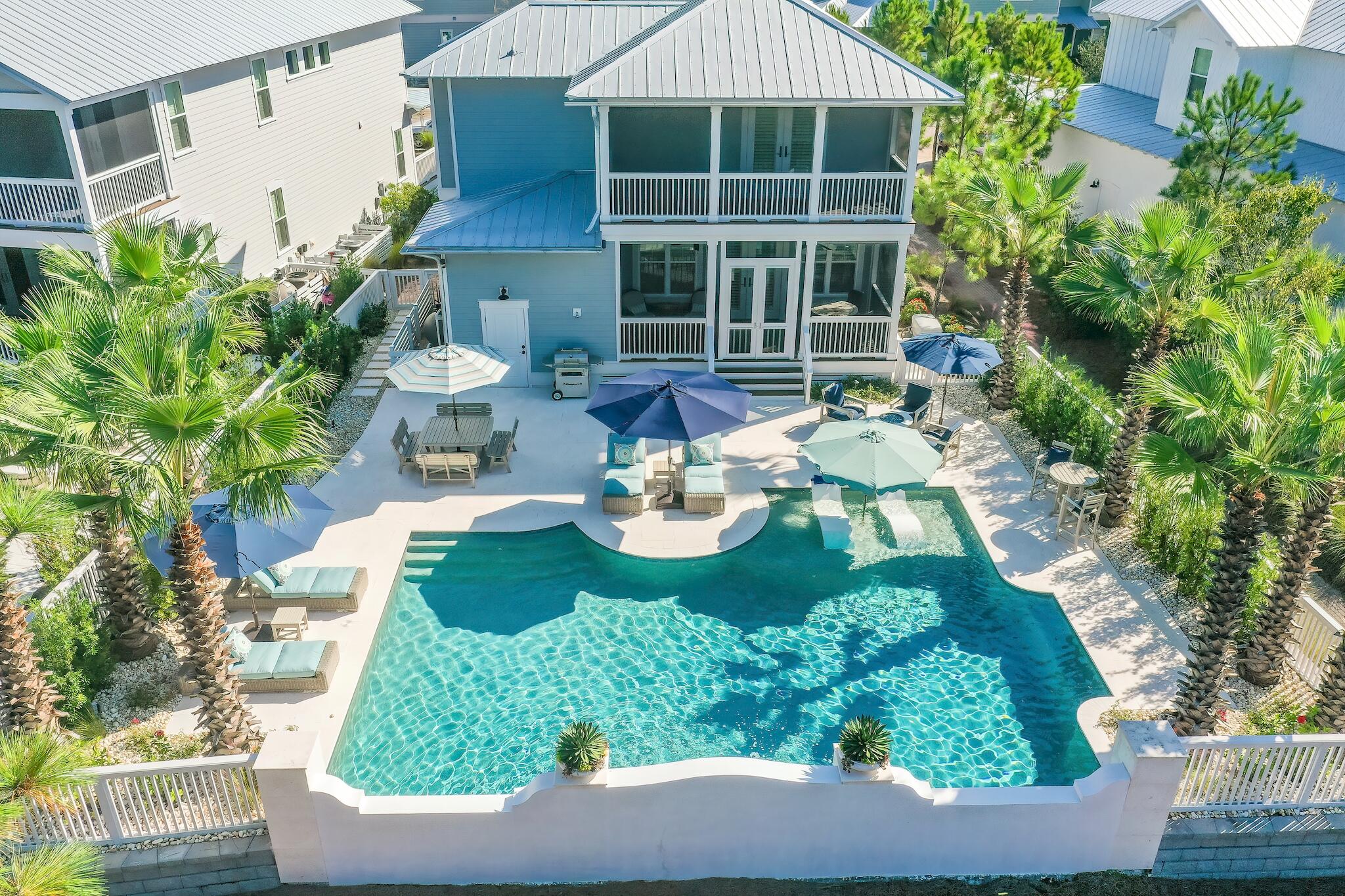 Step into your own private resort with this exceptional two-story Florida cottage, where an expansive 880-square-foot temperature-controlled saltwater pool sets the tone for elevated coastal living. Designed as the ultimate outdoor retreat, this stunning backyard oasis features a sun-drenched lounging deck and a cozy fire pit, creating an idyllic space for relaxation, entertaining, and unforgettable gatherings under the Seagrove skies. Positioned within the highly sought-after NatureWalk at Seagrove community, this residence offers a rare blend of luxury and investment potential. With a projected rental income of $133K annually, it presents a lucrative opportunity for discerning buyers seeking a second home or high-performing vacation rental. Spanning 2,572 square feet, the professionally curated interior effortlessly captures the essence of the Emerald Coast, with tranquil beach-inspired hues and refined coastal details flowing throughout its four bedrooms, four bathrooms, and open-concept living spaces. Every room has been thoughtfully designed to blend everyday comfort with timeless style. At the heart of the home, the chef's kitchen is a showpiece of form and function, showcasing sleek granite countertops, a custom-built range hood, classic white subway tile backsplash, and a grand 10-foot island complete with built-in wine storage and decorative shelving -perfect for hosting guests in style. Rich dark hardwood floors anchor the home's soft creams and ocean blues, creating a warm yet sophisticated ambiance. The primary suite offers a private retreat with its own covered porch, ideal for peaceful morning coffees or serene evening unwinds. Its spa-inspired en-suite bath features a luxurious soaking tub, a separate walk-in shower, and elegant finishes designed for relaxation and rejuvenation. Enhanced with thoughtful upgrades for year-round comfort and peace of mind, the home includes a whole-house Ronco generator for storm resilience and dual state-of-the-art HVAC systems to maintain the perfect climate indoors. Whether imagined as a personal seaside sanctuary or a top-tier vacation rental, this property delivers a rare opportunity to experience the ultimate in coastal luxury, function, and investment value within one of Seagrove's most coveted communities. The amenity-rich NatureWalk at Seagrove is situated in a premier location offering accessibility to area restaurants and the Watercolor Publix right next door and amenities such as a trail to the beach that's less than a mile and The Gathering Place that is centrally located and features a playground, heated lap pool, zero entry pool, hot tub, fire pit, grills, TV, bar area for a variety of gatherings and plenty of seating. Other community amenities include fitness stations, multi-purpose courts, pickleball, and a variety of trails throughout. Whether you're searching for an investment property, a second home, or a primary residence, come home to NatureWalk at Seagrove.