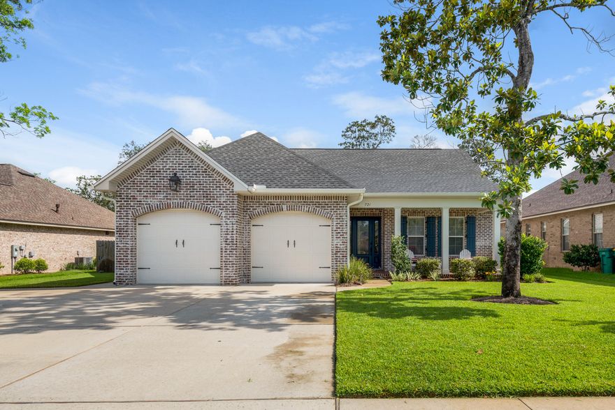 THIS IS THE ONE YOU'VE BEEN WAITING FOR! This magnificent 2015 one-of-a-kind home in prestigious Magnolia Woods is a semi-custom build with fabulous upgrades! The 2339 square feet live LARGE and include 4 bedrooms and 3 full baths. An open concept floor plan allows for great entertaining and seamless transitions from one space to the next. You'll enter this beautiful home from a covered porch, large enough for furniture yet quaint and private. The -3/4 glass front door allows natural light to flood the foyer while the gorgeous wood-look flooring sets the tone for an updated and modern home. From the foyer you can access bedroom 1 and 2 with a jack-n-jill style bathroom. This ample sized bathroom features a dual vanity, an oversized tiled shower, and separate toilet room. (Click more...)