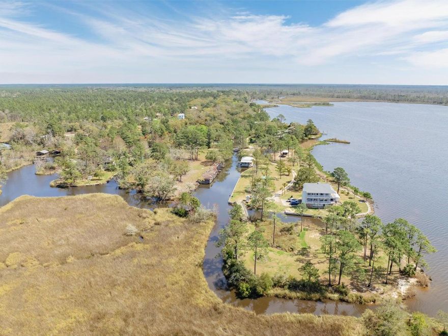 PRICED TO SELL!Old Florida waterfront living at 602 Pitts Bayshore Drive, Freeport. Situated on an oversized double lot (.79 acres), this 4-bedroom, 3-bath home with 2,475 sq. ft. of space invites you to embrace both family comfort and the luxury of life on the water.From the moment you arrive, the canopy of majestic live oaks welcomes you into a property that feels timeless, private, and full of possibility. The setting is truly unmatched 195 feet of protected canal frontage provides quick and easy access to Choctawhatchee Bay and the surrounding rivers, making every day feel like a boating adventure waiting to happen. This home is designed for the waterfront lifestyle with two fully covered boat slips with lifts, private boat launch for effortless days on the water and a fully powered boathouse workshop with dual entry doors for storing gear and equipment. Fall in love with the expansive yard space for gatherings, outdoor entertaining, or simply enjoying the natural beauty.

Step inside and large windows bring the outside infilling the home with light while framing serene water views. With spacious living areas, multiple bedrooms for family or guests, and a location that balances quiet neighborhood living with easy access to Highway 98, this home is ideal as a primary residence, vacation retreat, or investment property.

What sets 602 Pitts Bayshore apart is the lifestyle it offers mornings spent fishing off your dock, afternoons on the boat exploring Choctawhatchee Bay, and evenings under the oaks enjoying the peaceful coastal breeze. Here, every detail echoes the charm of Old Freeport while providing modern updates like a new AC system (2025).

This is more than a homeit's a place where families can grow, memories can be made, and the luxury of waterfront living can be yours every day.