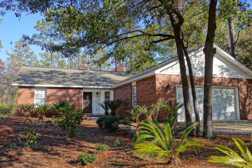 Attractive brick ranch-style home in the heart of Point Washington. Highly liveable with half-vaulted ceilings in the living area which opens up to a spacious eat-in kitchen. This home features a large master bedroom and two additional bedrooms. The property is unfurnished, but comes with major appliances including a washer and dryer. Ample storage and parking with a two car attached garage and two additional parking spots in the driveway as well as a private fenced yard. The home is being updated with new interior paint, carpet and vinyl flooring. Plus, a new dishwasher. Come quickly! *Reach out to the owner directly with questions and interest. One month rent and security deposit required*