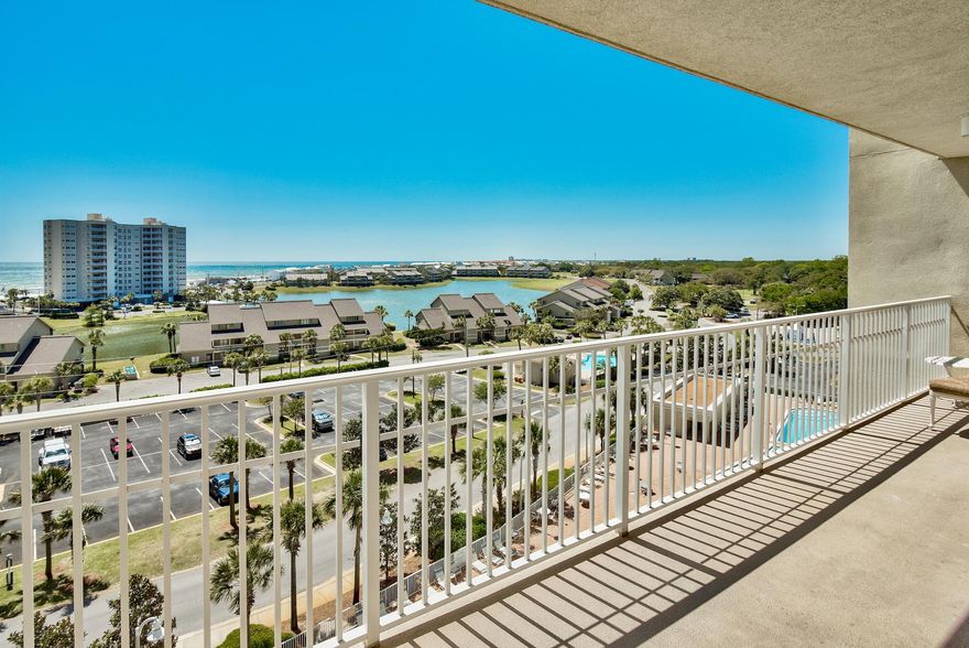 This spacious 3 bedroom, 3 bath, fully furnished condo is priced to sell. A large balcony provides stunning Gulf and lake views. There are tile floors in the living/dining area, kitchen, baths and hallway with carpet in the bedrooms. The kitchen has granite counter tops and plenty of cabinet space. There are gulf views and terrace access from the master bedroom. The master bath has double vanities, garden tub and separate walk-in shower. Resort amenities include 2 pools, fitness center, meeting room, and deeded beach access. The Seascape Resort offers gated entrance, 18 hole golf course, tennis and conference center. This condo would be perfect as a primary residence, second home or vacation rental property. This unit is a ''must see''.