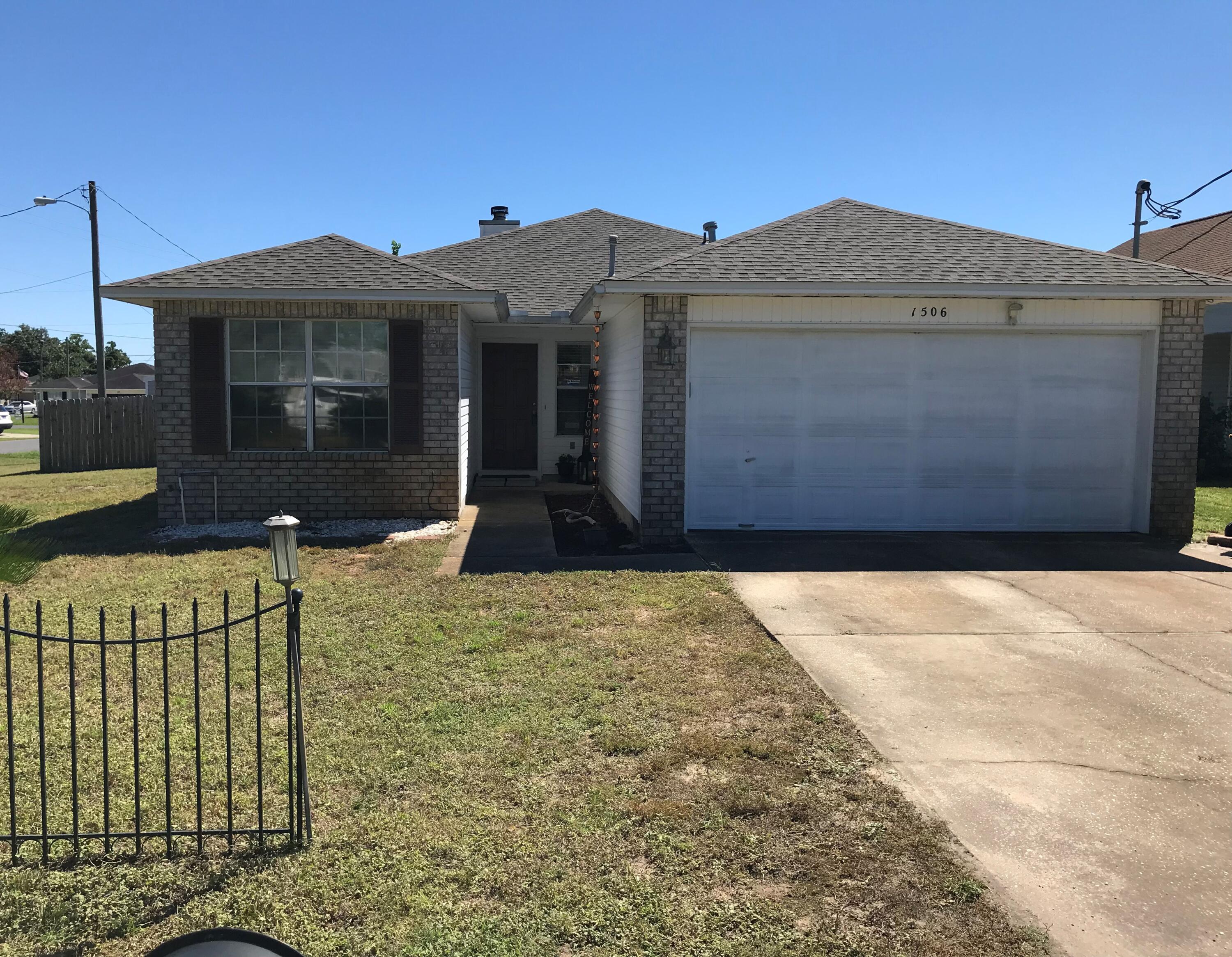 This charming home on a corner lot is just 4.2 miles from Hurlburt Field & has a new roof. As you enter, you are immediately welcomed by the spacious living room with laminated flooring, raised ceilings & the warmth of a wood burning fireplace. The living room flows into the dining area, and bright kitchen that has plenty of natural light & features a newer refrigerator. The master bedroom has plenty of space for all your furniture. The master bathroom has dual vanities & a well-organized walk in closet. The guest bedrooms are also ample sized. From the dining area you can take your dinner outside and enjoy the fresh air in the screened enclosure area without pesky insects. The back yard is fenced & has a wide gate. The outside screened enclosure flows onto the fantastic pergola