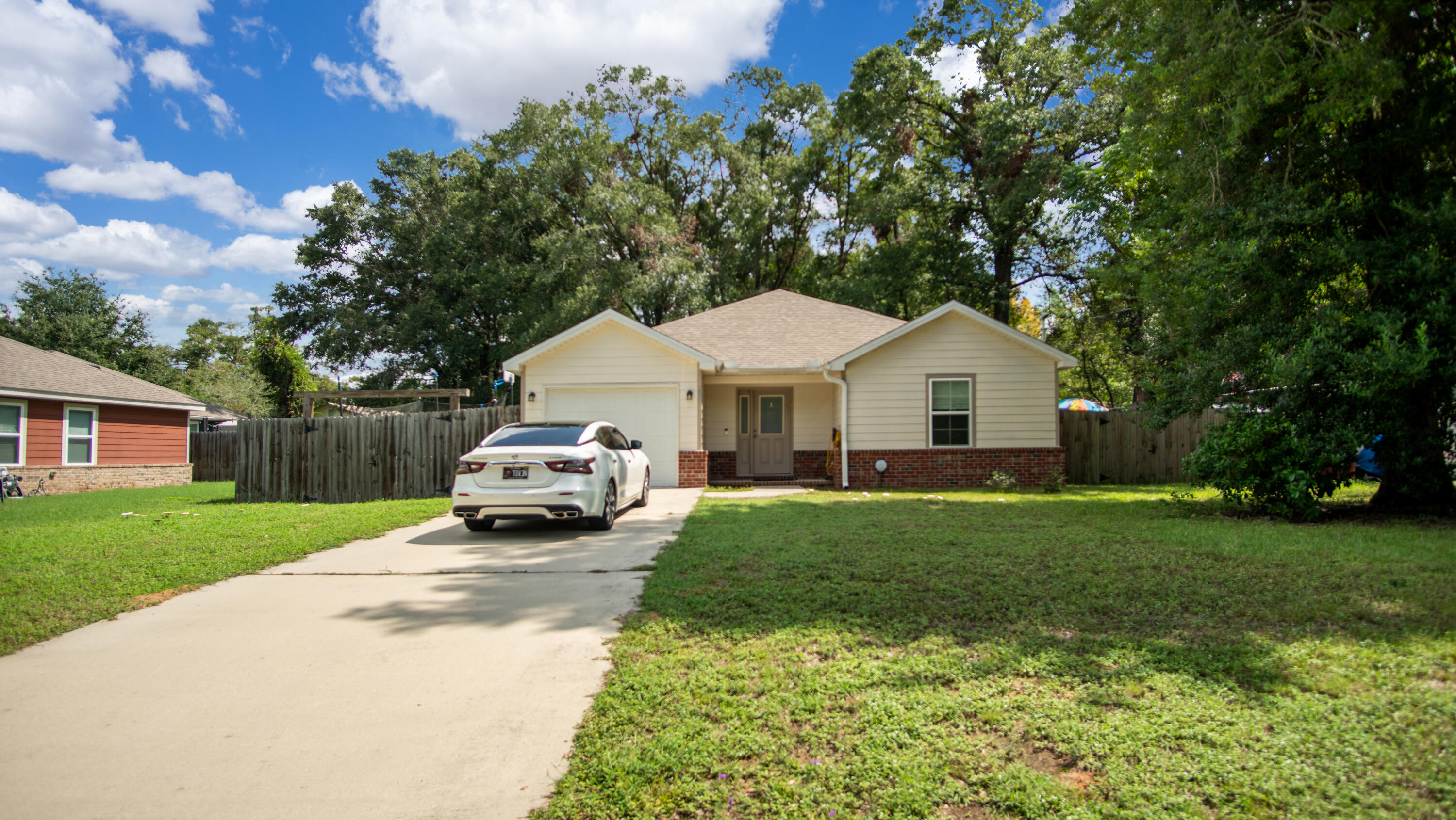 Discover this charming 1,278 sq. ft. home nestled in Northwest Crestview. This perfect starter home features three bedrooms and two bathrooms. It includes eco-friendly solar panels on the roof. Home has modern appliances such as an electric range, dishwasher, and microwave. The cozy bedrooms are carpet for added comfort. Step outside to a large backyard, complete with a 12'x14' patio-perfect for grilling, entertainment, and spending time with the family.