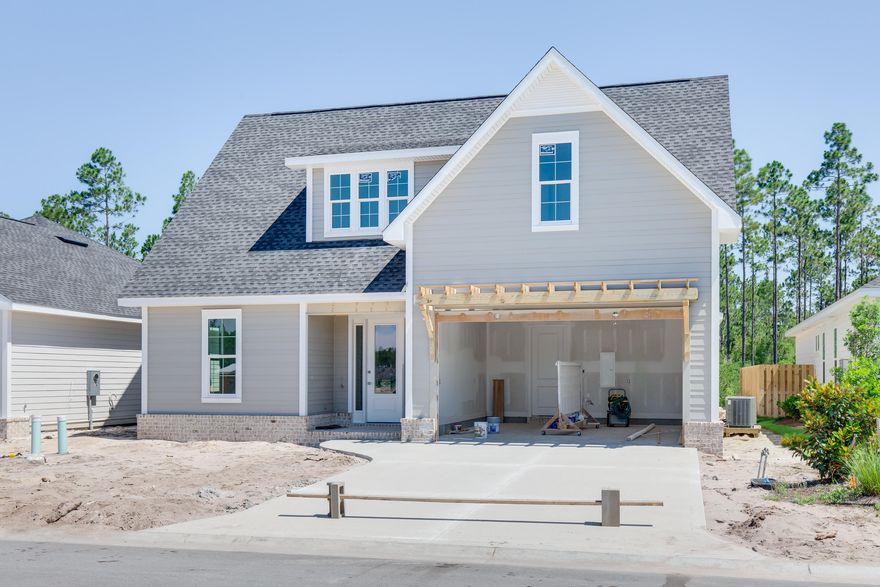 The 2 story Draper Plan has 3 bedrooms and 3 baths with a 2 car garage and porch. This open floor plan includes 9' ceilings throughout, quartz kitchen and bathroom countertops, upgraded Bosch stainless steel appliances, Rinnai tankless water heater, wood cabinetry with soft-close features, crown molding, Luxury Vinyl Flooring throughout, and subway tile. Notable exterior features include heirloom brick, irrigation system. The Watersound Origins community is a wonderful neighborhood full of amenities including the Village Commons pool & fitness center, miles of nature trails, dock access to Lake Powell, unlimited golf and much more. Estimated Summer Completion date