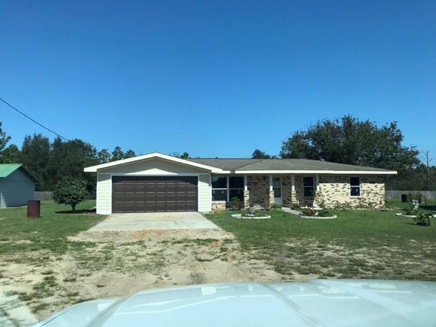 Nearly 2 1/2 acres privacy fenced with a 1589 sq. ft. brick home with double car garage. Seller is adding new floor covering in non-ceramic tile areas, new kitchen cabinets, new stove, microwave/fan and dishwasher, all new windows and more. A/C is appx. 2 years old. Large storage shed appx 14x18' Yard is fully fenced with a 6' privacy fence.