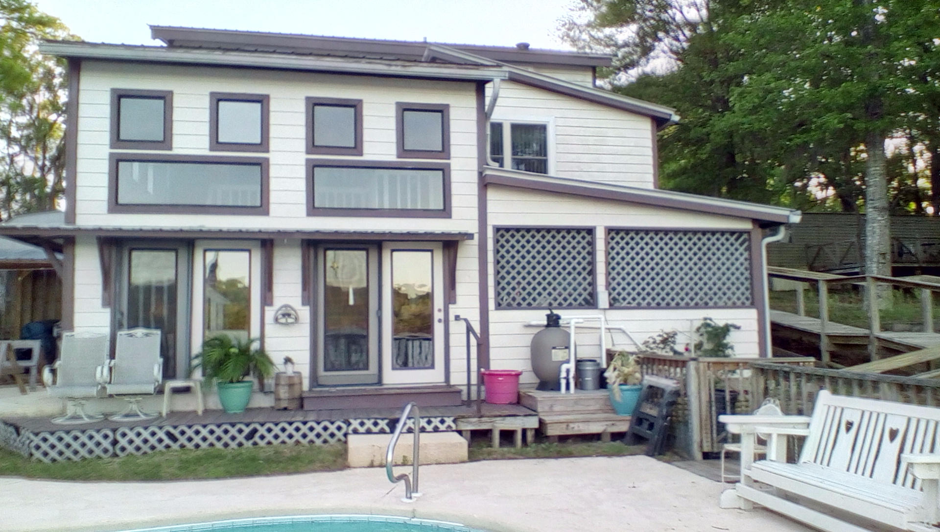 Price Reduced!!!Waterfront Home - Lake Juniper! In ground Gunite pool! Dock. 1/2 interest in boathouse. Two master suites. Cypress plank interior walls. Custom stone fireplace. Island kitchen stove. Lake Juniper is a state managed lake. Record bass & bream! Shown by appointment