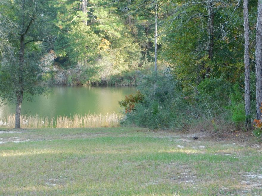 Exclusive large lot on Mirror Lake! Bring your house plansand you Boat!! 1.10 AC level ground to build you dream house!! Lovely neighborhood and lakefront lot!