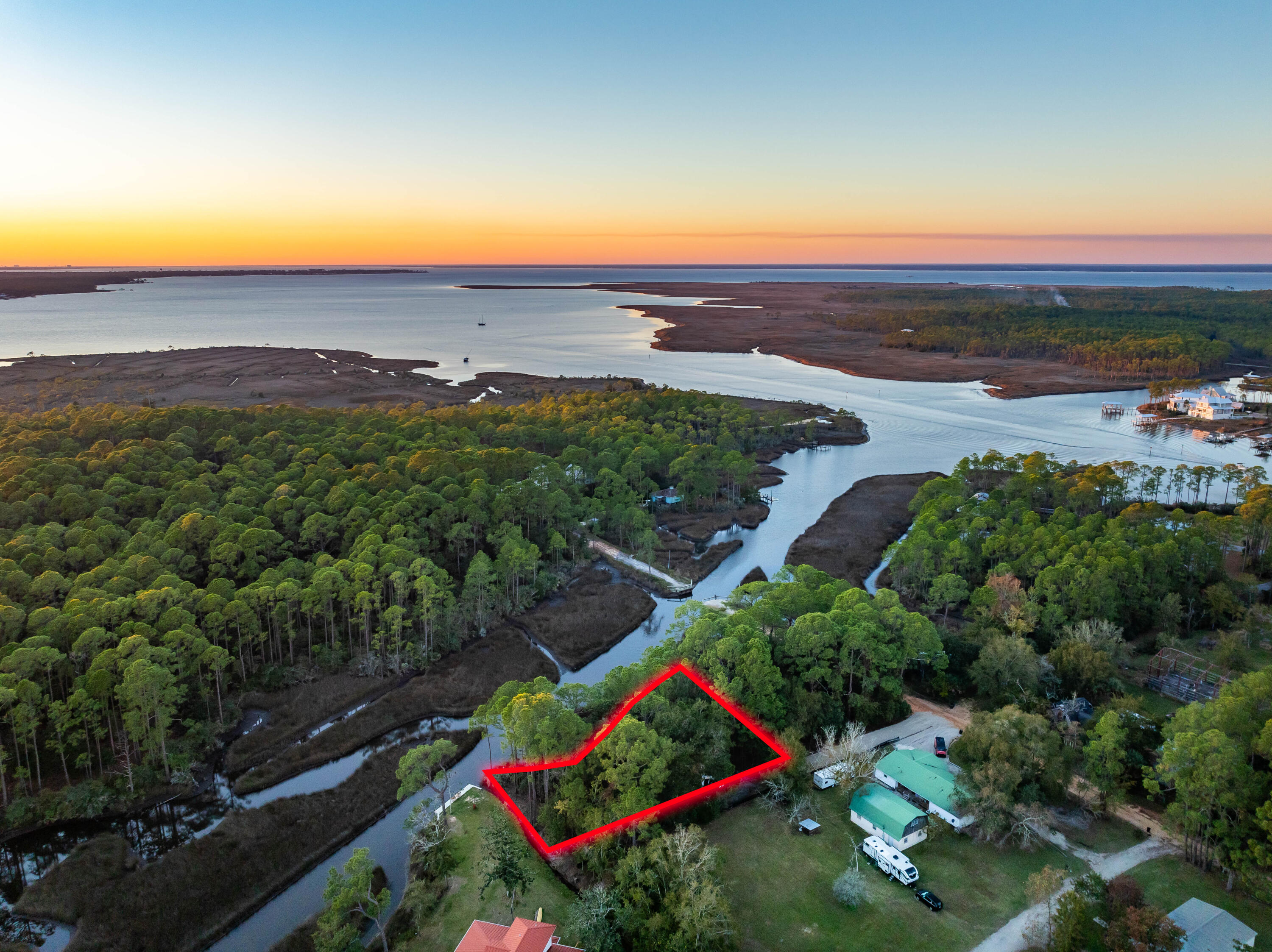 An exceptional waterfront property in Santa Rosa Beach is now available. This western-facing lot offers stunning panoramic views of Hogtown Bayou, paired with deep-water access that makes it a true haven for boaters.Located just moments from Cessna Landing, this lot provides easy access to the beaches and the vibrant lifestyle of 30A's west end, including Gulf Place, Shunk Gulley, and other local favorites. Whether you're looking to build your dream home or secure a prime investment, this property delivers on location and lifestyle.Key features include:Unmatched Hogtown Bayou viewsDeep-water access for boating enthusiastsUtilities available: water, sewer, and electricClose proximity to beaches, dining, and shoppingCreate your own piece of paradise and enjoy the best of waterfront living in Santa Rosa Beach. Survey available upon request.

Experience the Charm of Santa Rosa Beach Waterfront Living