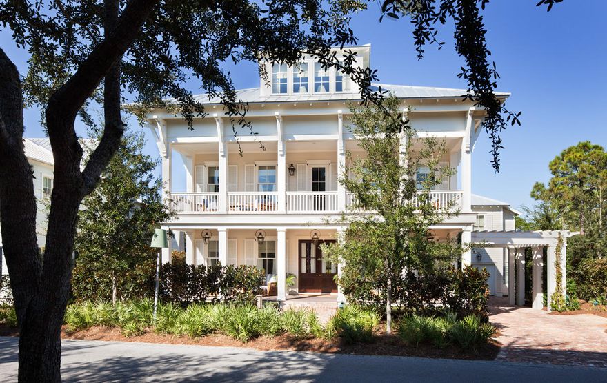 Enjoy this stunning WaterColor plantation style house with deep double verandas across the front. The living, dining and kitchen entertaining areas are conveniently located on the second level to take in the beautiful views of the gulf and lake. The living and dining rooms form one large rectangle, while the kitchen runs perpendicular to the dining area to create an L shaped space. Gather outdoors on the second story porch to watch the sunset or catch the breeze. With the public rooms located on the second level, the bedrooms on the first and third floors are afforded additional privacy. On the ground level are the master bedroom, the library and an enchanting bunk room the embraces 4 beds each with its TV. The third level consists of two guest bedrooms, and for relaxing and lounging, there is a TV/family room with a balcony offering beautiful views of Western Lake and the Gulf of Mexico.  Also included in the stunning residence oversized two car garage with a carriage house atop that contains a guest suite with a kitchenette. 