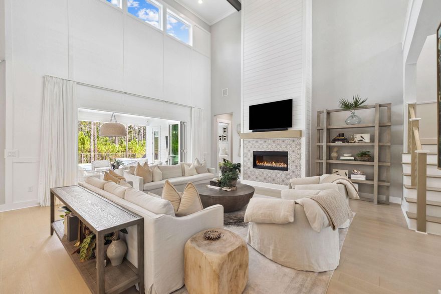 Welcome to 394 W Lafayette Road, a stunning residence that epitomizes luxury coastal living. Built by Kolter Homes, this Venice plan showcases nearly every available upgrade. The thoughtfully designed 4-bedroom, 3.5-bath, 3,736 sq. ft. layout offers an exceptional blend of craftsmanship, elegance, and functionality--all within the highly sought-after gated community of NatureWalk at Watersound Origins.Step inside to soaring 20+ foot ceilings in the great room, anchored by a grand fireplace and bathed in natural light. A dramatic wall of bi-folding glass doors seamlessly connects the interiors to an extraordinary outdoor oasis, creating the ultimate setting for entertaining or relaxed everyday living.The chef's kitchen is a showpiece, boasting a professional-grade gas  cooktop, built-in refrigeration, expansive island, custom cabinetry, and an oversized walk-in pantry. A stylish mudroom with laundry and abundant storage ensures the home is as functional as it is beautiful.

The primary suite on the main level is a true retreat, offering spa-like luxury with a massive walk-in shower, freestanding soaking tub, oversized double vanity, and a spectacular custom-designed walk-in closet. Upstairs, guests will enjoy a spacious secondary living area, a private en-suite bedroom, and two additional guest rooms that share another beautifully appointed bath.

Step outside to a resort-inspired sanctuary featuring a heated pool, oversized spa, expansive shellstone deck, full outdoor kitchen, and lush landscapingall backed by a preservation area for maximum privacy. With three garages, white oak flooring, designer lighting, and timeless gas lanterns, every detail reflects quality and sophistication.

Living in NatureWalk at Watersound Origins means access to two sets of premier amenities, including resort-style pools, clubhouses, fitness centers, pickleball and tennis courts, and a championship golf course. Just minutes from Scenic Highway 30A, residents enjoy sugar-white beaches, emerald waters, upscale dining, boutique shopping, and endless outdoor adventures in South Walton's parks and nature preserves.

This home is more than a residenceit's a destination. Experience refined living, everyday convenience, and the very best of Florida's Emerald Coast lifestyle.