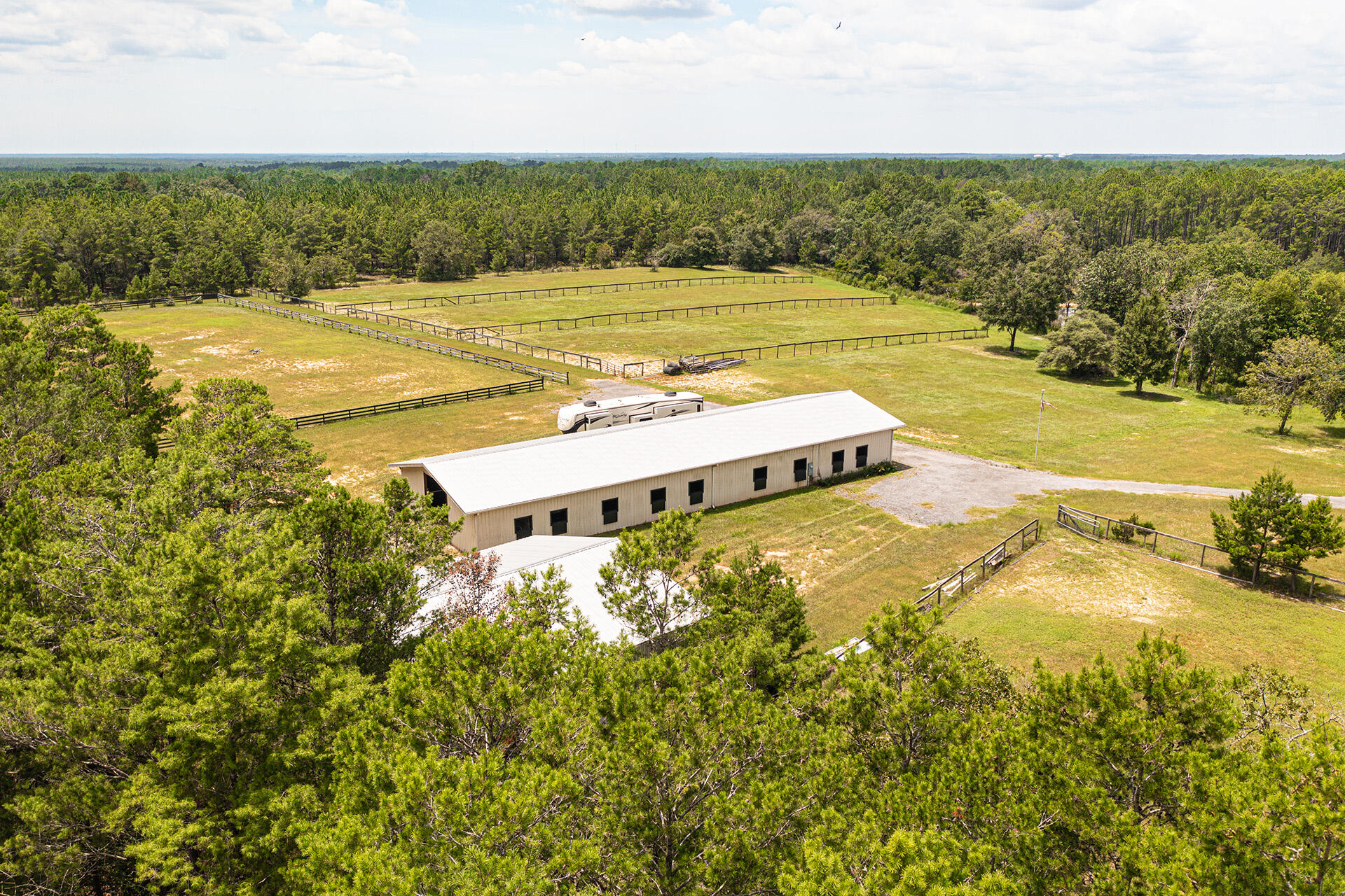 ONE OF A KIND- Equestrian Ranch envelopes 21 beautiful acres .The 120' x 36' stable showcases 15 stalls, tack room, cooled office space, half bath & private security camera/tack room. A 40' x 40' Hay barn, Closed in for protecting large equipment, house trailers or RV Storage. A 100'x300' training arena adjacent South of the stable as well as 5 paddocks. Property includes 2 wells, new pump houses, 2 septic tanks & 2 separate entrances. This ideal location offers the option for you to Build your dream homes East corner or West corner overlooking the Ranch & Beautiful Pond.The natural, spring fed pond sits center of the property & adjoins the Wildlife Conservation preserve. Beach access, 35 miles N 30A. The Pond and Stream that runs south is part of the South Walton Water Eco System.
This is worth viewing..It speaks for itself with the privacy and peacefulness. It is rare to locate this size parcel, this distance to the Gulf ...
This property could also be transformed into a Recreational facility, Brewery's and Winery's are becoming the destination of vacationing travelers. To create social event venues for Music, Art, Parties or Weddings.