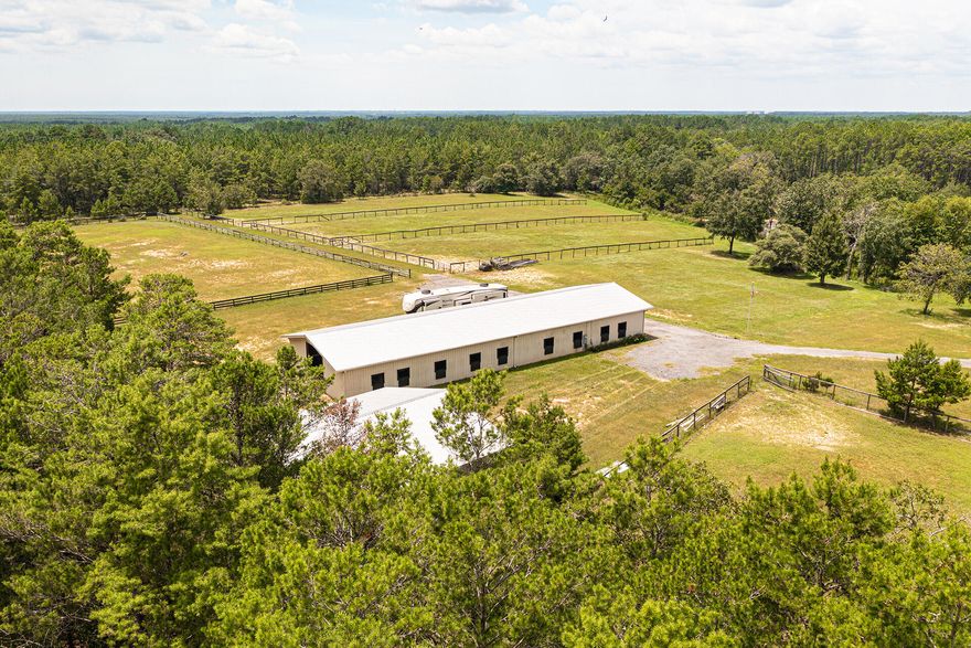 Space for the family or business, Land that most dream of.  Equestrian Ranch that envelopes 21 beautiful acres. The 120' x 36' stable showcases 15 stalls, tack room,  office space, half bath & private security camera/tack room. A 40' x 40' Hay barn, closed in for protecting large equipment, house trailers or RV Storage. A 100'x300' training arena adjacent South of the stable as well as 5 paddocks. Property includes 2 wells, new pump houses, 2 septic tanks & 2 separate entrances. This ideal location offers the option for you to create your dream home's. Choose the East corner or West corner overlooking the Ranch & Beautiful Pond.The natural, spring fed pond sits center of the property & back adjoins the Wildlife Conservation preserve. Designed for Horse enthusiast but multiple investment . The Pond and Stream that runs south follows the flow of the South Walton Water Eco System. 
This is worth viewing..It speaks for itself with the privacy and peacefulness. It is rare to locate this size parcel, this distance to the Gulf ... 
This property could also be transformed into a Recreational facility, Brewery's and Winery's are becoming the destination of vacationing travelers. To create social event venues for Music, Art, Parties or Weddings.