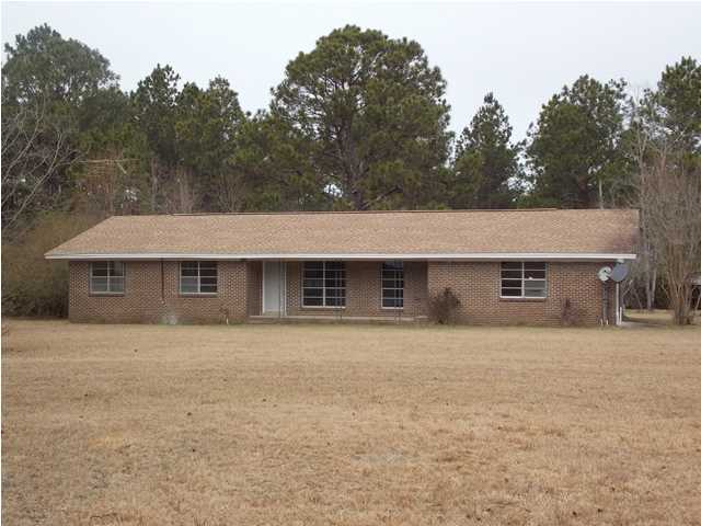 COUNTRY LIVING AT IT'S FINEST!!! Looking for that farm life with fresh air and enough room to garden, have cows or horses?? This is the place you have been waiting for! There is even a small stream on the back of the property where the previous tenants had a stand for hunting the plentiful deer! This lovely ranch style home sits on 15+ acres in North Walton County on a paved highway. New paint, new roof, and new bathrooms are already in place. The home is clean and ready for a new owner's touch to make it cozy and inviting. The current owner has made repairs and taken care of much of the work that you would want to do to a home of this age. The living room is huge and could accommodate almost any furniture or dcor. The dining area and kitchen with a large bar have room for your family