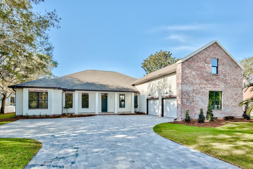 New Construction - Custom Built Waterfront Home in Destin, Florida by Reiker Homes!  Style meets comfort in this family friendly home that offers one story living with an additional bonus space over the 2-car garage.  This spacious home has 4 bedrooms and 4 1/2 bathrooms with 4,569 square feet of living spaces and beautiful covered porches off the front and back of the home.  Water views abound from the moment you enter the foyer and continue into the open floor plan living room that boasts a fireplace and built-in cabinetry.  The chef's kitchen includes a breakfast nook with beautiful natural light and views.  Outdoor views continue into the owner's suite which connects through to the laundry and drop station.  The Florida lifestyle will be easy to enjoy with this home's outdoor kitchen, wa