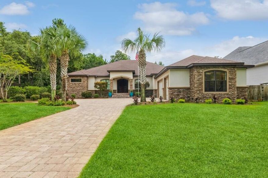 This is the home you've been waiting for! Unique and exquisite with quality craftsmanship and attention to detail that comes from being the builder's personal home!  From the moment you approach the house, the three-car garage with 9-ft doors and the beautiful landscaping catch your eye. The arched double wooden doors provide a grand entrance, leading you into a foyer with a 12-foot ceiling that captivates you immediately. The great room, adorned with hardy oyster marble flooring and tasteful decorative elements, adds elegance and sophistication to the living space. The grand family room draws your attention, but your gaze is also drawn towards the spacious outdoor retreat visible through the wall of glass doors. The kitchen is a culinary haven, complete with a generous island, double sinks, a dual-fueled Thermador oven/cooktop, a built-in Thermador refrigerator and coffee bar.  The gathering place in the kitchen is exceptional. The reclaimed Memphis brick and vintage doors add unique character and a sense of history to the space. The challenge of finding the brick with the lodged bullet adds an intriguing aspect.  The current table comfortably seats 16 with room to spare! 

The primary bedroom, with its own set of doors leading to the backyard oasis, is a spacious retreat. The primary bath stands out with its freestanding copper tub against a stacked stone backdrop.  The chandelier over the tub brings character and a touch of luxury making you want to linger in a hot soak. 

The covered back patio seamlessly extends the living space by almost 1,000 sq ft and offers a variety of features, including a dining area, a sitting area with a built-in fireplace, and an outdoor kitchen.  As if that wasn't enough, the outdoor living continues into an expansive screen patio with a heated pool and hot tub! The adjacent protected wetlands and the glimpse of the bay from the pool area create a serene and private atmosphere.  It is perfect for al fresco dining, hosting gatherings or offering an escape from the hustle and bustle of daily life.  Just outside the pool area you will find a bonus outdoor patio with a built-in firepit. 

This well-designed single-story home has split residency with the primary bedroom on one side and 4 additional bedrooms on the other wing.  The home also offers many functional details such being energy efficient, impact resistant windows, 2 x 6 framing, a convenient ?? bath in the pool area, 2 sets of washer/dryer hookups, an 8-camera security system, built-in speakers, tankless hot water heater and so much more.  The meticulous maintenance of the house makes it show like new.   

I can't wait to show it to you in person! 

All information and measurements believe to be correct but should be verified by buyer if deemed important.