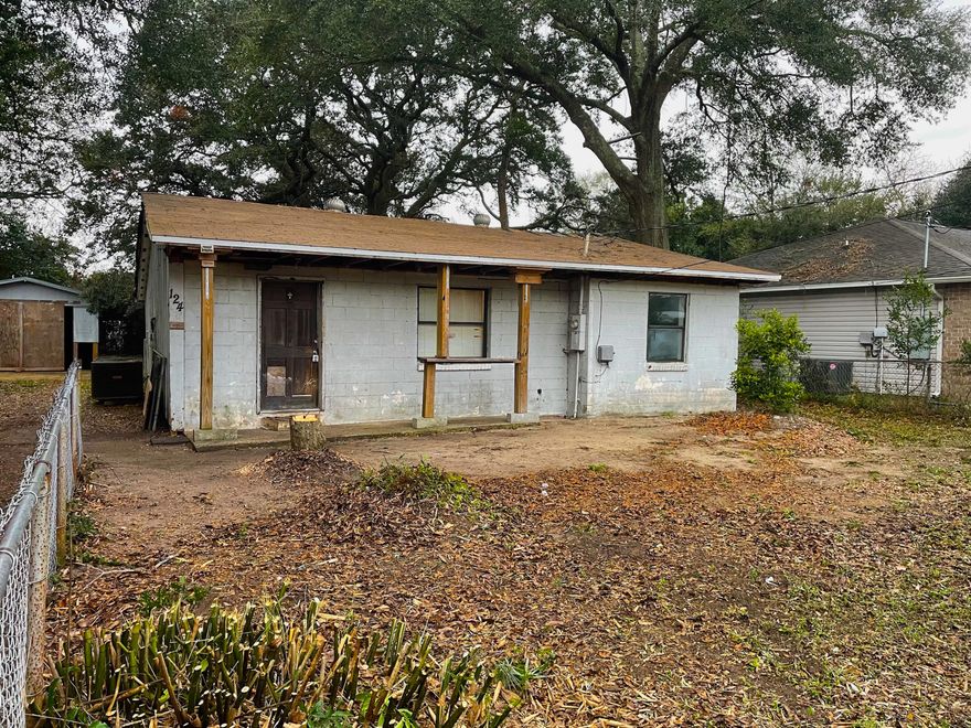 AMAZING fix & flip or investment opportunity with this Ocean City home in Fort Walton Beach! If you're looking for a project house in an AWESOME neighborhood and location - You found it! This home is a 2 Bedroom / 1 Bathroom with 950 sqft. (total). The lot is huge with a big detached garage and a gorgeous 200+ year old towering oak tree in the backyard. This is a very sturdy block home with lots of open room inside for a great redesign. It's on city water and sewer, and all utilities are on. Obviously it needs some work, but with some elbow grease it could be a gem. At this price it is a STEAL and WILL NOT LAST LONG - So act quickly!
