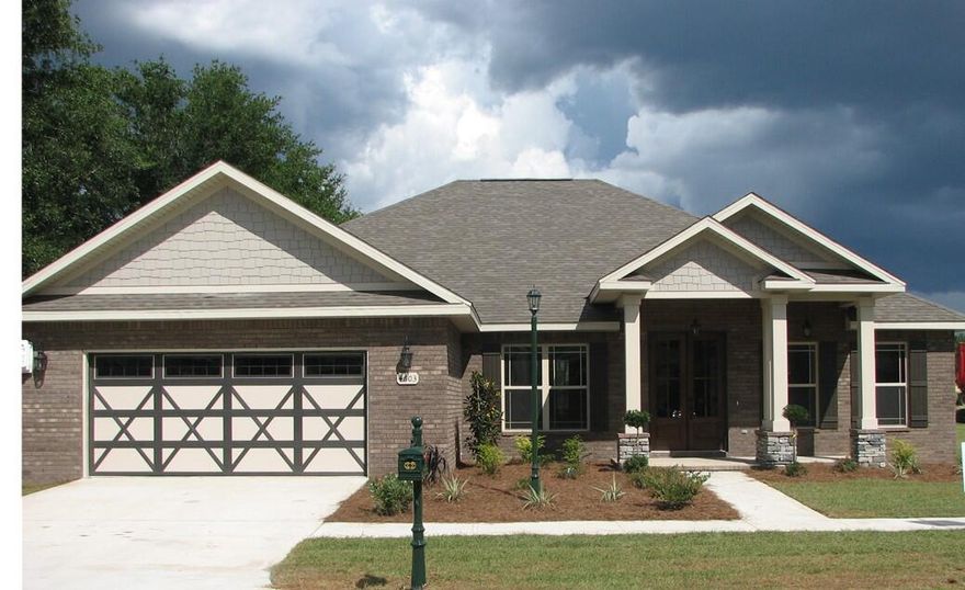 This beautiful custom home South of I-10 in a wonderful gated community. Home features a 3/2.5 split floor plan, with an office/flex room, formal dining area in addition to the eat in kitchen, 2 car garage. Open concept design with gorgeous luxury vinyl tile floors throughout your main living areas, baths and laundry. Gourmet kitchen features granite counter, stainless steel appliances, to includes a wall oven, separate cook top, dishwasher, microwave, oversize breakfast bar.  Craftsman style trim and raised ceilings throughout home. The master bath has a shower and separate tub, double vanity, and an extra-large master closet. All bedroom to be carpeted. Covered porch in back for relaxing and entertaining. Photo is of a similar home colors and style my be different.