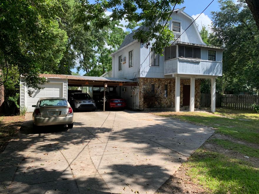 Great opportunity to own income producing property! 2 separate units. Live at one, rent the other or rent them both! Large lot with the house secluded towards the rear. Main house consists of 1/1 downstairs unit. Second floor entrance to very nice upstairs 2 story unit featuring bonus room, screened Florida room, fireplace, and large master closets. Property has large 2 car carport, a large enclosed storage building with a garage door, and a separate laundry building. Upstairs unit is currently rented for $950 per month.