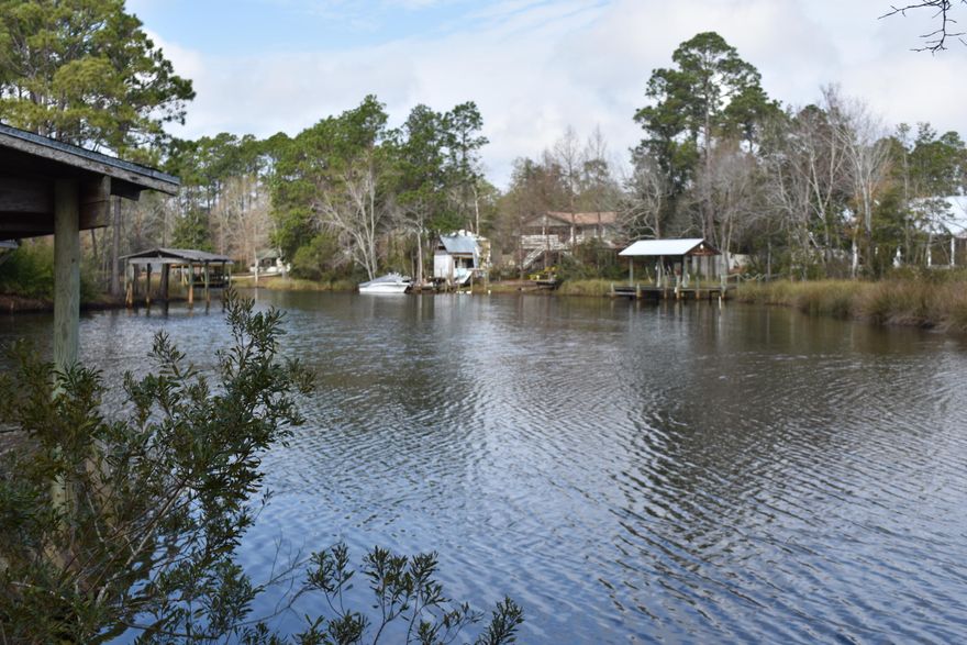 Half Acre Waterfront Lot in Freeport off of Highway 331 with easy access to the beach or the fast growing City of Freeport. This large waterfront lot is located on a finger of Mallet Bayou. Build your waterfront dream home, as there is a deed restriction Mobile Homes are not allowed. fThis large lot has great utility making the possibilities as expansive as the views. There is a boat lift and dock that will need work. This lot is mostly located in Flood Zone X with AE 7 located at the rear closest to the water, Where do you find a waterfront lot with the ability to build a home not requiring flood insurance? See attached survey. City water available. Septic tank needed. This lot is conveniently located and Waterfront at a great price!