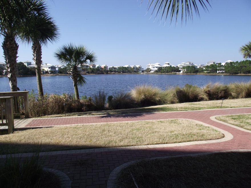 A great investment or your perfect beach getaway! Nicely furnished 1 bedroom 1 bath ground floor unit has everything you need for your stay at the beach. Fully appointed kitchen with stainless steel appliances, granite countertop, in unit combination washer/dryer, and laminate floors throughout with tile in the kitchen & bathroom. Enjoy a glass of wine while you watch the sun set over Lake Carillon. Located at the west end of Panama City Beach, just east of the Walton County line, nestled along the shores of Lake Carillon with access to 3900' of pristine white sandy beaches. The community of Carillon Beach features 7 beach walkovers, 4 pools (one of which is gulf front), tennis courts, parks, fitness center & spa, shops, restaurants & walking paths. Convenient to local attractions and