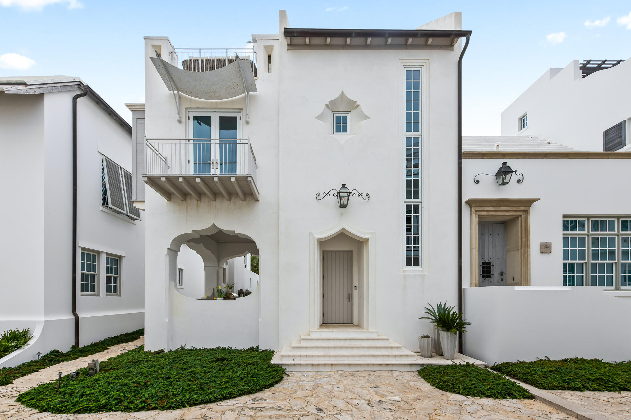 Experience the quintessential Alys Beach lifestyle at 14 Shinbone Court, where stunning water views of the Gulf of Mexico await you from the captivating third-story roof terrace. Nestled along the picturesque Seagarden Walk Pedestrian Path, this newly listed residence is just six homes removed from direct beach access to the pristine white sands of the Gulf of Mexico. Designed by the renowned architectural firm Domin Bock Architects, this exceptional home is a perfect embodiment of luxury coastal living. The unique bookend home site features a sunlit first-floor courtyard that runs the entire length of the property, inviting refreshing Gulf breezes into your living space. The first floor is dedicated to leisure and entertainment, opening seamlessly to the courtyard, which boasts a hot tub cascading into a generous swimming pool, a summer kitchen, and an outdoor loggia complete with a cozy fireplace. Accordion doors span the length of the home, allowing for an effortless transition between indoor and outdoor spaces, creating an ideal atmosphere for gatherings and relaxation.
With 3,150 square feet of conditioned living space, this exquisite home offers a harmonious blend of comfort and style. The open layout of the kitchen, dining, and living rooms creates a welcoming environment, perfect for hosting friends and family.
This residence features four spacious bedrooms, each thoughtfully designed to provide a unique retreat for family and guests. The primary suite is a peaceful haven, featuring two private balconies with French doors that flood the room with natural light. Each guest bedroom is tastefully decorated, ensuring a comfortable stay for even the most discerning visitors. As a bonus, the exclusive owners' Alys Beach Club is conveniently located nearby, giving you access to additional amenities and a vibrant community atmosphere. 14 Shinbone Court is more than a home; it's a lifestyle waiting to be embraced. Don't miss the opportunity to own this remarkable propertyschedule your private showing today!