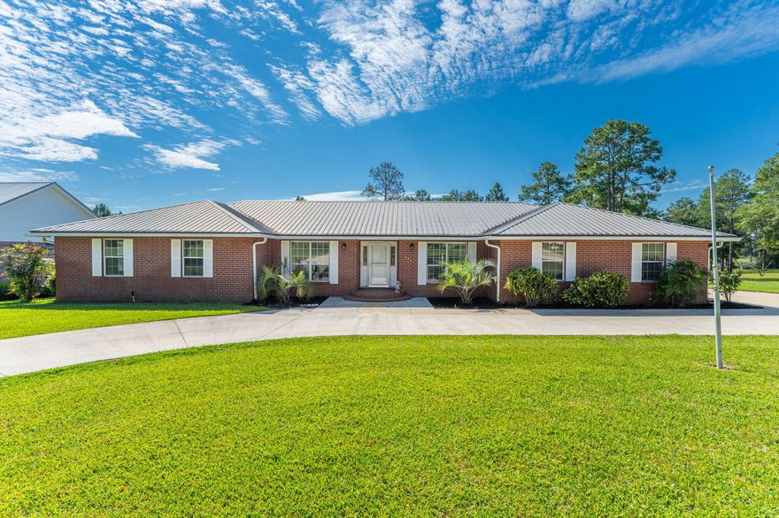 Spacious Waterfront Brick home in Beautiful Ten Lake Estates located just 5 miles North of DeFuniak Springs. Features include 3 bedrooms, 2 baths plus an additional half bath in the garage. lake views from the living room, Breakfast Nook and master bedroom. Home also includes a separate dining room plus a sitting room - perfect for home office or just a quiet area for reading. On the back of the home is a Sun Room with AC and ceiling fan that also faces the lake. Sun Setter Awning. The Sun Room opens to a 22x19 deck with a grill bump out for those afternoon cookouts!! Seller has redone the dock with railings and a swimmer's gate. The 2 car garage includes a workshop area plus a Great Area for Darts!!! A half bath is also in the garage. Circular Drive offers additional parking.