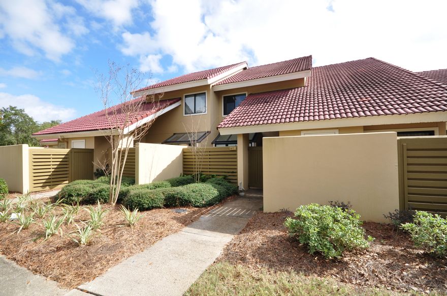 Lakefront townhome within 1/2 a mile to the beach! Located on the northern side of the lake with a well manicured back yard and open patio. Featuring low maintenance tile throughout the main living area and a centered kitchen with dual breakfast bars to the dining area as well as the living area. Offered fully furnished and rental ready. The versatility of this home would easily allow its use as a primary residence, second home or vacation rental property. This home is a very short distance to the Beachwalk community pool and to the newly rejuvenated Market Shops, offering an array of dining and shopping venues.