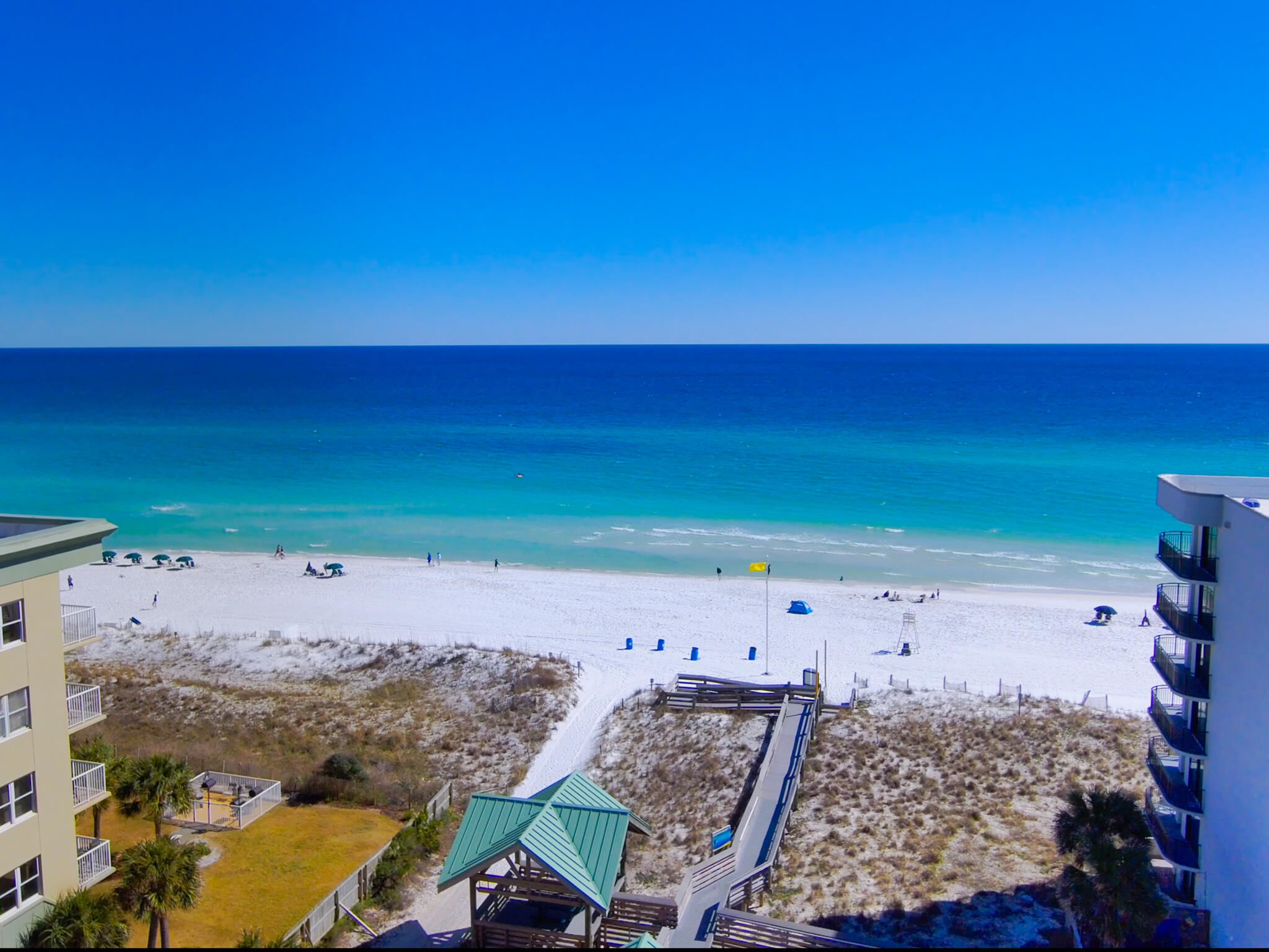 Stunning views of the Gulf! Fully-furnished (everything you see), turn-key and ready-to-rent condo that sleeps 6. Excellent rental history; in 2024 the net was over $40,000 with key times still being used by the owner. Both the living room and the primary bedroom have gorgeous views and balcony access. This refreshed condominium has a large kitchen with newer cabinets, quartz counters, a stainless steel appliance package (1-yr old refrigerator), and a breakfast bar. Newer cabinets, counters and flooring in both baths. Wake up to paradise in the prime suite brightened up with updated flooring and the bath has a double vanity. New fixtures and hardware throughout; completely repainted; new Miami/Dade rated windows and sliders; new electric breaker box; new thermal roller blinds, and more.. Nautilus is a beach-front complex with a private beach that has beach chairs and umbrellas provided. In-house rentals services are offered, but owners may elect other options, including self-management. Located on Okaloosa Island with convenience stores, restaurants, music venues, a mini-golf course and other fun options, Nautilus offers it all. Okaloosa Island is located along the Emerald Coastline and is part of Fort Walton Beach. New infrastructure is in the works, including a brand new bridge over the sound side of the island and a new path along Highway 98 towards Destin that will surely make the island more desirable than it already is. Hurry! This is a great opportunity! Grab your swimsuit and stake your place on the beach!