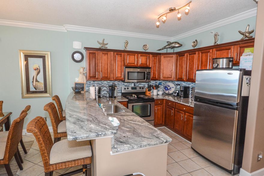 Low Floor, East end, Gulf front 3 bedroom condo with two master suites opening on to a 10' x 44' wide balcony for stunning gulf views. Rental income exceeds $70K! This spacious 3 bedroom condo is ideally located at the quiet, West end of Panama City Beach just a short drive to Hwy 30A, Pier Park, with its hundreds of shops, restaurants and entertainment and the Airport. The kitchen has been upgraded with a beautiful tiled backsplash, stainless steel appliances and cherry wood cabinets. The balcony offers amazing East end views plus and has been recently tiled for low maintenance. The AC and water heater were replaced in 2016. This upgraded and unique condo is a rental machine with years of strong rental history.