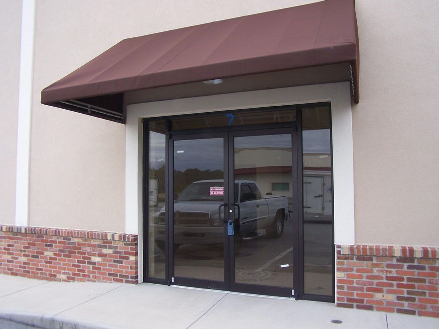 This industrial park conveys two separate buildings; Building 1 and Building 2. The subject space (Unit 6) is the End Cap Space of Building 1.  Unit 6 space plan offers 1725 square feet of warehouse space with a Glass Store Front entrance, a 14 ft. roll up door, and a man door in the rear of the building.  The space is stubbed out for a 250 sqft heated and cooled office and bathroom if there is a need for Flex (office) Warehouse Space Plan.