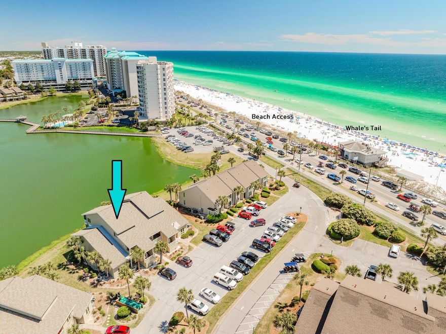 280 STEPS TO THE BEACH!  LOCATION, BEAUTIFUL LAKE VIEWS, NEW SIDING, WINDOWS, PORCHES & 132K ASSESSMENT TO BE PAID IN FULL set this 3 BR condo apart from the others. Identical unit in bldg doing 78K RENTALS this year! Wake up to serene lake views & enjoy your coffee from your quiet, lakefront screen porch.  You're on vacation so forget about driving! Spend the morning on the beach & the afternoon at the comm pool, just steps away.  Stroll across the street to catch the sunset & enjoy a Gulf front dinner at The Whale's Tail. Relax while enjoying calming lake views from all the main living areas & the spacious master BR. W/golf, tennis, pickle ball, biking, MOONCRUSH CONCERTS & great restaurants located in the community a short golf cart ride away, there's no need to ever drive your c Ideal as a primary, 2nd Home, or investment property, this wonderful condo is sold fully furnished & turn key.  NEW WINDOWS & EXTERIOR SIDING provide peace of mind & affordable $807/ month total HOA covers community amenities, exterior insurance, exterior maintenance, roof, water, sewer, trash, internet! Act now and start living the beach lifestyle you've always dreamed of.  