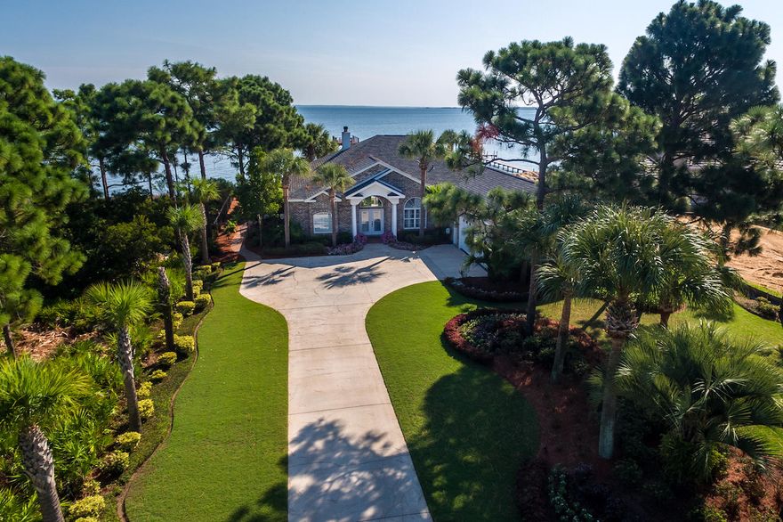 Incredible Bay Front home w/Stunning Views! All New Updates Completed April 2017: Hardwood Floors Throughout Main Living Areas, Porcelain Tile Floors in all Bathrooms, New Carpet in all 3 Bedrooms, Quartz Kitchen Counters & Backsplash, Master Bathroom, Vanity w/ Quartz Top, Quartz tops in Guest Baths, New Master Shower. From the glass front doors you can see the View! House was designed for capturing all of the Gorgeous Bay Front...Open Design, One Level spacious home with 10' ceilings and nInterior just painted. Plantation Shutters throughout. Living Room with floor to ceiling built in bookcases w/wiring; Sound System w/Continuous Power Source, Living Room Fireplace; open to the Dining Room, this house just flows for easy living! Large Master Bedroom with double walk-in closets.