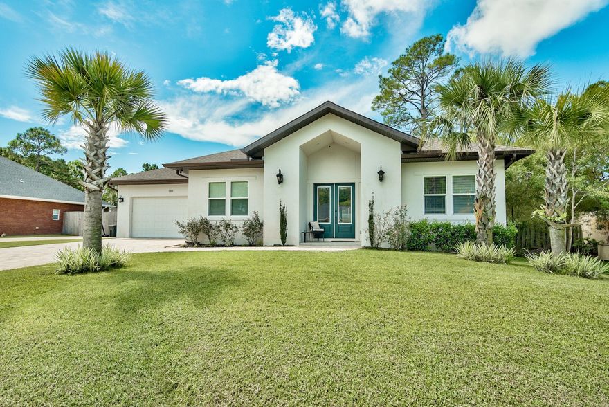 Welcome to 989 Forest Shore Dr. This 2016 built home is centrally located in Miramar Beach walking distance to the bay, and is just a mile and half to the beach! Features of this 4 bedroom/2.5 bath home are numerous. The spacious living room offers vaulted ceilings and lots of natural light. The incredible gourmet chef's kitchen offers quartz counters, Frigidaire Gallery stainless steel appliances including full size fridge/freezer and gas range, as well as a huge breakfast bar/island. The large master suite includes tray ceilings with accent lighting, master bath with huge separate shower and garden tub, as well as a custom built walk-in master closet.The oversize enclosed back lanai offers a gas fireplace, cable hookups, and is plumbed for a full Summer kitchen with sink and grill.