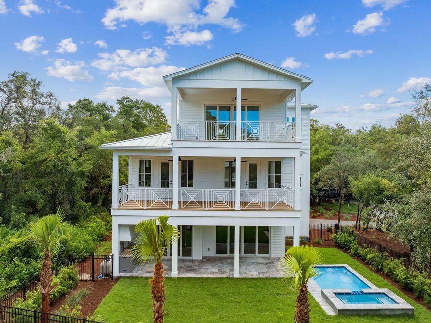 Nestled on a coveted private road in the heart of Grayton Beach, 86 Grayton Trails is a stunning new-construction residence designed by the talented team at Foresight Design and built by CM Taylor Construction. Grayton Trails Road offers mature century-old oaks, shady magnolias, and towering pines, creating a dense canopy and arguably one of the most serene settings on all of Scenic Highway 30A. Completed in August of 2025, this home encompasses 4,460 sq ft of heated and cooled living space, including 7 bedrooms, 7 full bathrooms, and 1 half-bathroom. Ten-foot ceilings and an abundance of natural light add to the home's sense of spaciousness. A private pool & spa, large fenced-in yard, outdoor kitchen, and 2-car garage add to the home's appeal.After entering through the home opens into an expansive living, kitchen, and dining area - large enough to host multiple families at a dinner party. The living area is accented by a red queen brick wall with a built-in gas fireplace. The kitchen features high-end Subzero and Wolfe appliances, a generous 4'x10' island with a large farmhouse sink, custom cabinetry, and a walk-in pantry with bonus storage area. This floor has one oversized bedroom with an ensuite bathroom. From the living/dining area, sliding glass doors reveal the fenced-in backyard, a heated pool and hot tub, summer kitchen, and additional covered outdoor living and dining areas.

An extra-wide staircase leads to the second floor, showcasing the primary bedroom suite, along with three additional bedrooms, each with their own bathrooms and shared balconies. The primary suite features accented lighting, two closets, a roomy double vanity, and a dedicated shower area with a soaking tubThe laundry closet, with 2 sets of LG washer/dryers, is on this floor.
 
The third level offers an additional living/bonus area with a wet bar and mini fridge. This floor is complete with a 6th bedroom with an ensuite bathroom and a twin-over-twin bunk room and bathroom.

Situated on a generous .33 acre lot, this beautiful beach compound offers a large driveway and an enclosed two-car garage, a rare and welcomed amenity for any home on 30A, but especially for Grayton Beach. The entire 1/3 acre lot falls in Flood Zone X where flood insurance is not required.