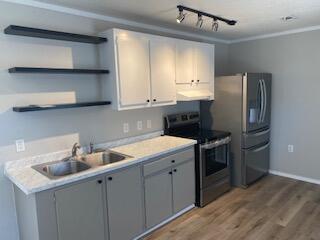 Fully renovated manufactured home ready for new owners! Outside, you will see that the yard has recently had new chain link fencing added. Also, both doors have a deck, perfect for grilling or entertaining. You will notice the open concept as you enter. All new lighting and ceiling fans brighten the rooms, which boast new Cali Bamboo LVP throughout the home. The kitchen features beautiful cabinets with new countertops and open shelving for storage. Also, check out the new stainless steel stove and refrigerator. The split bedroom plan has one bedroom in the front of the home and one in the rear. The renovated bathroom also features a bard door for that country feel. Septic tank is around 2 years old. Schedule your appointment today!