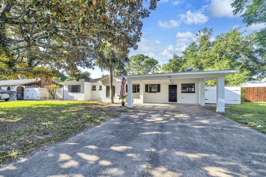 Welcome to this beautifully renovated single-story brick home, ideally located in the heart of Fort Walton Beach--just 1.1 miles from HWY 98, providing quick access to beaches, shopping, and both Air Force bases. A few yards away you'll find Jet Drive Park, which features tennis and pickleball courts, a playground, and a basketball court. This turn-key home has been completely remodeled from top to bottom, featuring a brand-new roof, soffit, and fascia, and a complete electrical rewire for peace of mind. Inside, you'll find new sheetrock throughout, along with modern trim, baseboards, and interior doors that elevate the space. The stunning kitchen boasts new shaker cabinets, brand-new stainless steel appliances, and stylish finishes.  Durable and low-maintenance luxury vinyl plank (LVP) flooring runs seamlessly through the home. Both bathrooms have been updated with new vanities, and the master bath includes a brand-new tub. Additional upgrades include all new light fixtures and electrical hardware, plus new exterior doors for enhanced curb appeal and security. Step outside to your own private oasis featuring a fully fenced backyard and a sparkling inground poolperfect for entertaining, relaxing, or beating the summer heat.