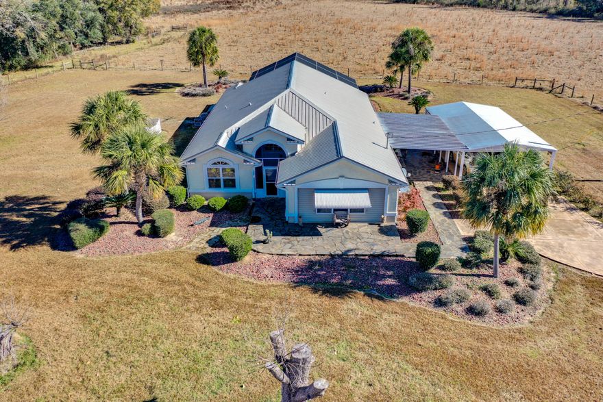 Time to breath in some country air? Here's your chance to own your own Florida Ponderosa! This modern country Jackson County 80-acre ranch has been beautifully cared-for. Custom home with large metal barn w/pole-barn is smartly situated in the center of the land and has so much to offer! Start cooking in a kitchen with gorgeous solid maple cabinetry, Corian counters and food pantry. Serve meals on breakfast bar or adjacent Breakfast Nook in the kitchen area, all open to living room. The master bed suite has abundant closet space. Master bath has both garden/jetted tub & separate shower, a double-vanity & extra closet space. Guest bedrooms are spacious sharing a hall & second full bathroom. French doors lead to concrete pool area w/ a covered lanai. Pool area also has it's own half-bath! The yard was professionally landscaped by the current owner to provide the feel of a Florida oasis including palm trees and slate/concrete patios with walkways and paths. Newer metal roof installed in 2018!! There is a large shop near home adjacent to carport/side patio area.

Until recently, this has been a running 80-acre cattle farm. Property is fenced and gated for livestock management. There is a 3,200 SF metal barn and an adjoining 1,080 SF pole barn with livestock pens. Abundant wildlife from waterfowl to small game on mostly pastureland and wooded property. Hardwood and pine on wooded area which includes some wetland topography. Serene settings await you. Call today!