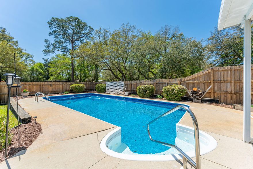 This stunning pool home offers 3 spacious bedrooms, 2 full baths, and a half bath, providing ample space for both comfort and convenience. As you enter the home, you're greeted with a clear view of the open dining area, which flows seamlessly into the large great room and offers a direct line of sight to the covered patio and pool area -- perfect for enjoying indoor-outdoor living. The home has been recently updated, with a beautifully renovated kitchen, updated bathrooms, and new lighting throughout. The downstairs features a large master suite complete with a walk-in closet and an en-suite bathroom boasting a new double vanity. The open dining area seamlessly flows into the expansive great room with a cozy fireplace, creating a perfect space for entertaining. The kitchen is a chef's dream, with new granite countertops, stainless steel appliances, and a charming eat-in area overlooking the sparkling pool. Upstairs, you'll find two additional bedrooms and a bathroom, plus a versatile loft space that could be used as a play area, office, or reading nook. 

As you enter from the garage, you'll notice the oversized laundry room, which provides ample space for laundry and extra storage  a convenient feature that adds to the home's functionality. Step outside to the large covered patio and enjoy the beautiful pool, perfect for gatherings, alongside a grassy area and a convenient storage unit. The expanded driveway offers plenty of room for a camper or extra cars. Located centrally between both military bases and just minutes from shopping and beaches, this home is ideal for those seeking comfort, style, and convenience.

Buyer to verify all dimensions. 
Extra features: hurricane panels, attic space with plywood allows for extra storage, and 2 car garage.  