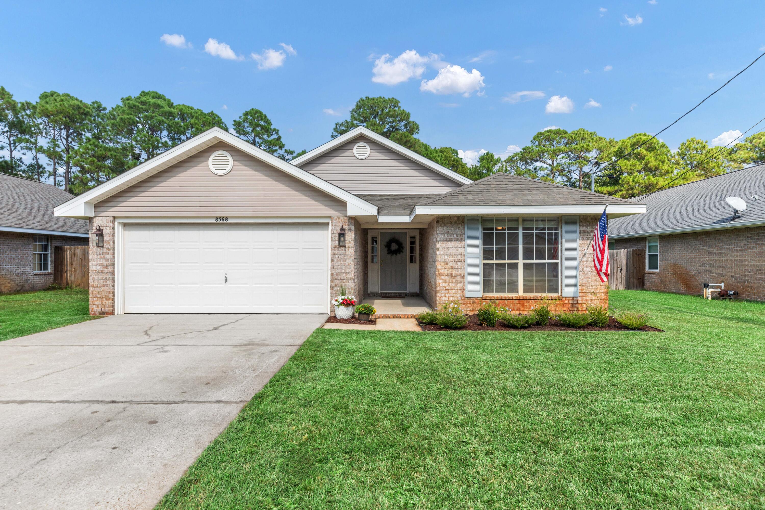 Meticulously renovated and maintained, this stunning home features vaulted ceilings, a desirable split floor plan, and a bonus living/dining area optimizing flexibility and only 2 miles from Navarre Beach! This gem includes a 2021 roof, a brand-new 2024 water heater, and a well-maintained 2012 HVAC for peace of mind. Additionally, within the last two years the sellers have upgraded the backyard fence, sprinkler pump, dishwasher, carpet, cabinet paint, kitchen counters, HVAC UV light disinfectant system, and more! Step outside to your fully fenced backyard with decorative lights, offering privacy and space for outdoor enjoyment. The included survey saves buyers money and adds convenience. Coastal living with comfort and thoughtful updates awaits you!