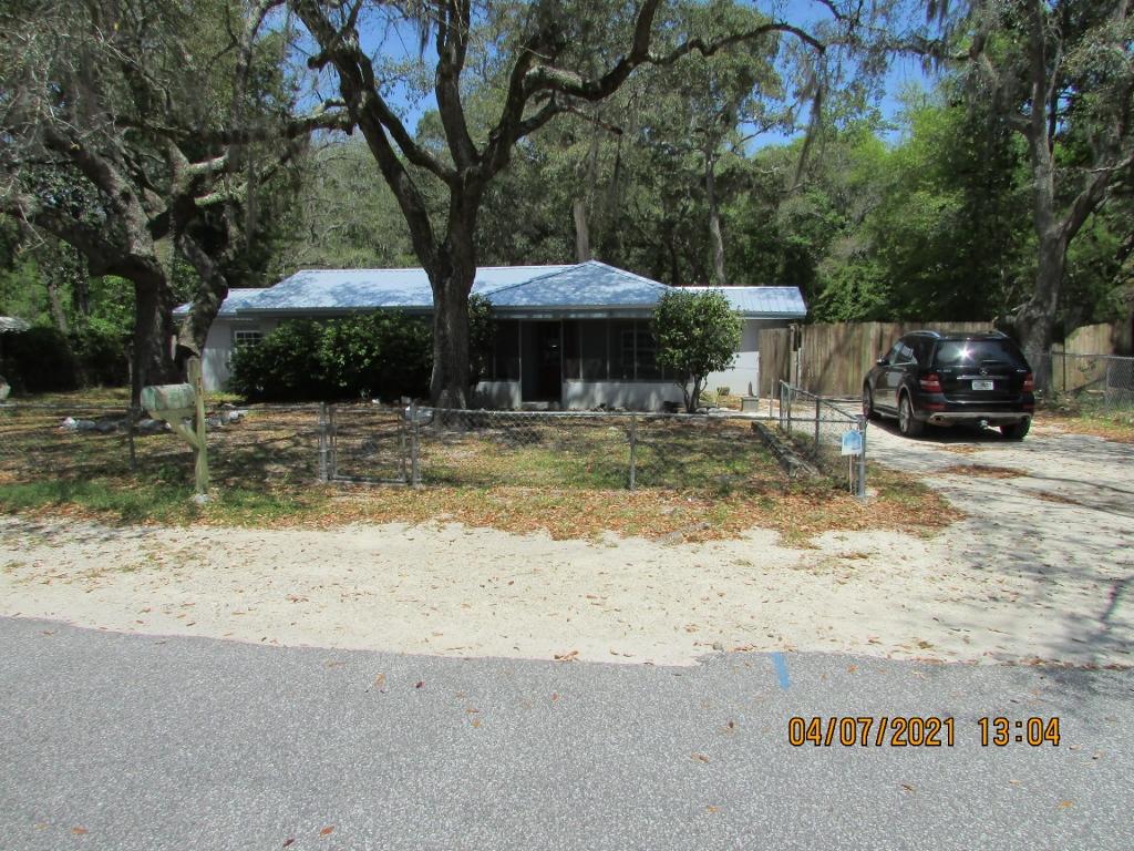 Nice large lot just north of the bay. Convenient location to south Walton and growing Freeport. New roof installed 2021. This home has a large back yard and is chain linked fenced with a partial privacy fence. Home will require TLC as property is being sold as is. Property in estate and will require court approval.