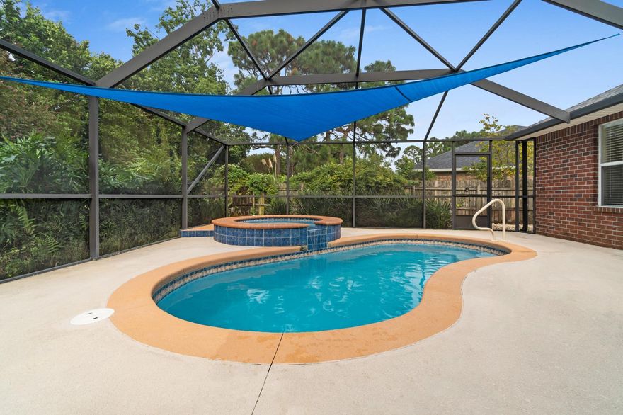 Four bedroom heated POOL home on a cul-de-sac in east Navarre with PAID OFF solar panels! Welcome home to this stunning all brick beauty featuring 4 true bedrooms PLUS two additional flex rooms perfect for a dining room, office, playroom, etc. Pull up into the driveway and appreciate the lovely tropical curb appeal, and you'll also notice the solar panels (completely paid off) on top of the new roof that's only two years old! Inside you'll find a spacious open floor plan home boasting almost 2800sqft! After you enter you'll find the two flex rooms on either side, one of which is completely enclosed with french doors. The massive living room features a fireplace, and it's open to the gorgeous and spacious kitchen. Complete with TONS of cabinet space, stainless appliances, granite counters,