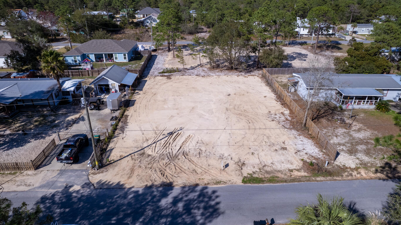 What a great opportunity to buy a cleared, quarter acre lot ready for your dream home! Right down the street from Walmart, First Watch, and The Donut Hole. Less than 3 miles to Grand Boulevard and only 1.4 miles to the west entrance of 30A. No HOA and located in Flood Zone X (No flood insurance required). Public sewer and water are available. If you are looking for a great location on a tranquil dead-end street, you have found it!
