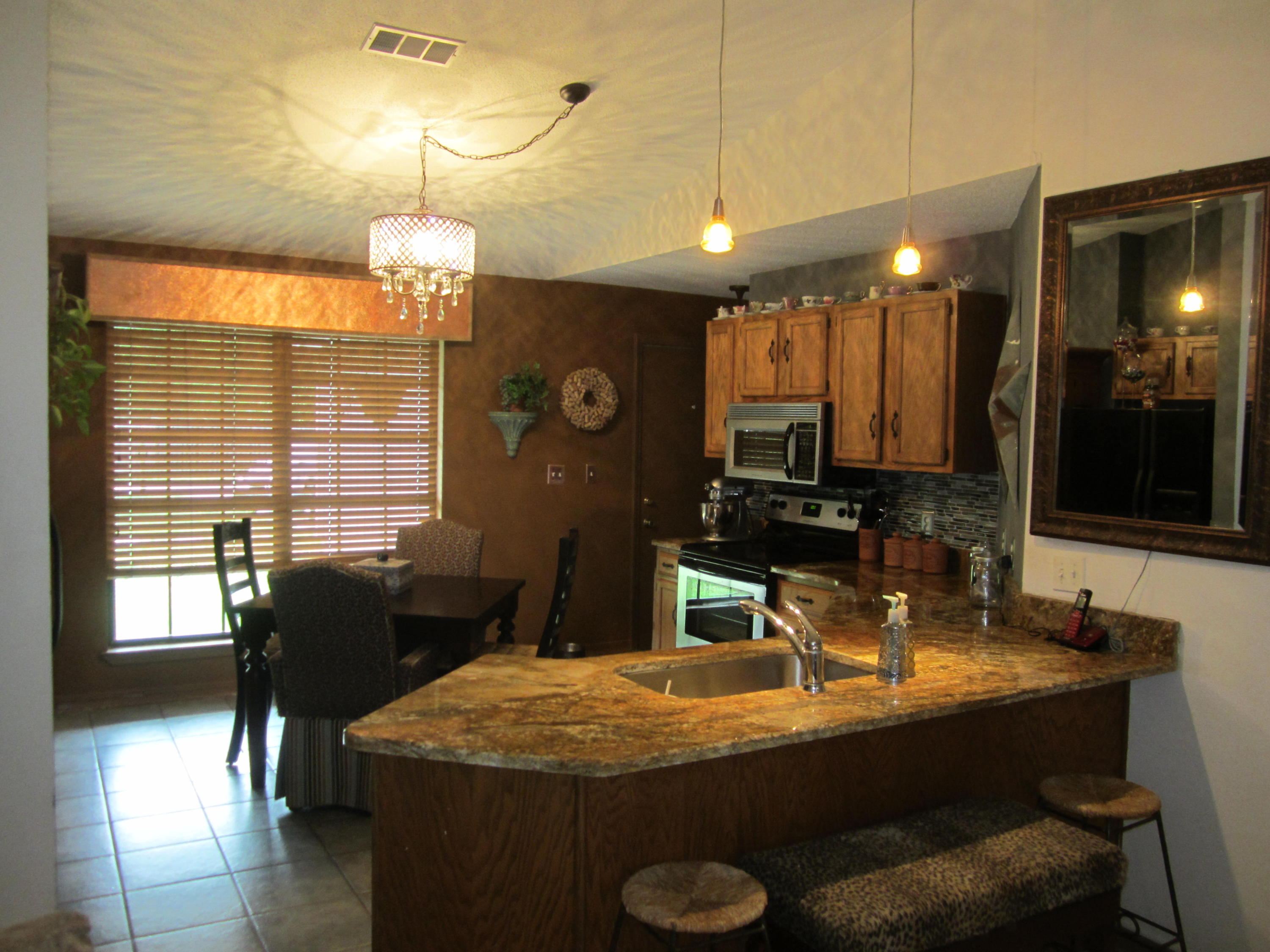 Well maintained home close to everything. Split bedroom plan.Updated kitchen with gorgeous granite counter tops and tile backsplash. Master bedroom has a walk in closet with plenty of space. Privacy fenced back yard backs up to woods, so no backyard neighbors. Side yard is large enough to store a boat or RV if a gate was put in. Seller has just replaced some of the siding. Seller is going to take the chandelier in the foyer and kitchen and the matching light by the garage door and pendant lights. She will replace them with the original fixtures(they were gifts from her parents)Refrigerator does not convey.
