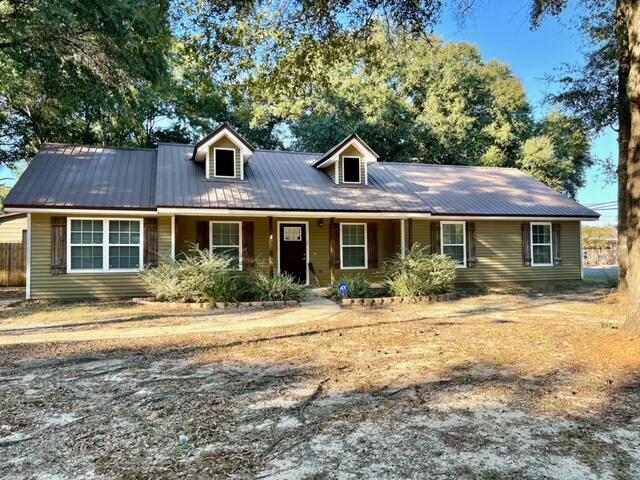 Available now..Easy commute to bases, beaches and shopping. Level corner lot features this 4/2 home with many upgrades. Farmhouse vibe with nice flooring, butcher block countertops, stainless appliance package, plenty of cabinet space. Spacious fully fenced in backyard perfect for the kids and family dog to play and run in. Large 18x20 workshop with separate yard building for storage. Converted garage is the 4th bedroom for space. Fireplace and much more. Large laundry with washer and dryer. No inside smoking or vaping. Pets will be allowed with a $400 non-refundable pet fee and owner approval.